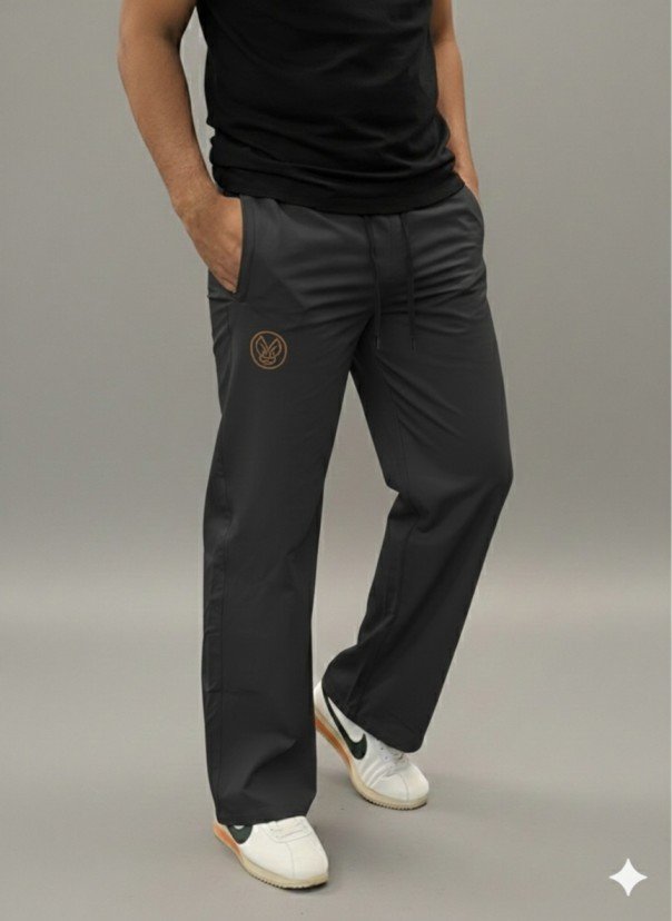 Men wearing black straight fit track pants with elastic waist and pockets