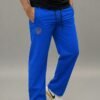 Men wearing navy blue straight fit track pants with side pockets