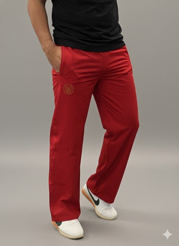 Men wearing red straight fit track pants with elastic waistband and side pockets