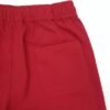 Men wearing red straight fit track pants with elastic waistband and side pockets