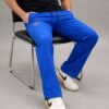 Front view of a man wearing Srathi premium navy blue straight fit track pants with elastic waistband.