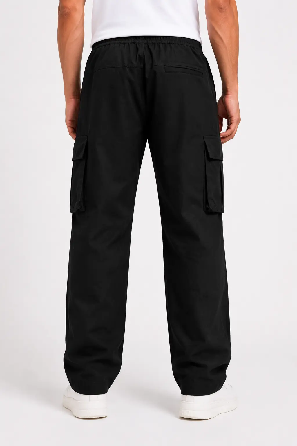 Back view of men’s black cargo pants with utility pockets